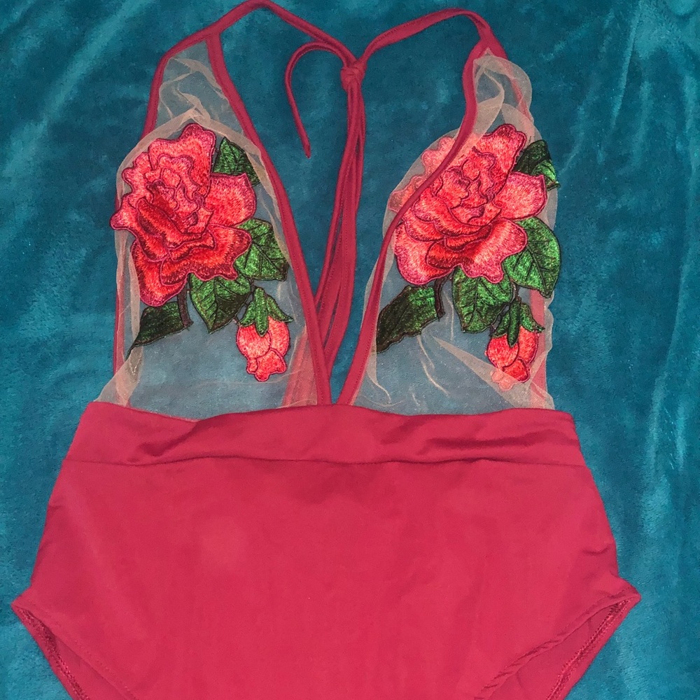 Red, rose themed, one piece bathing suit.